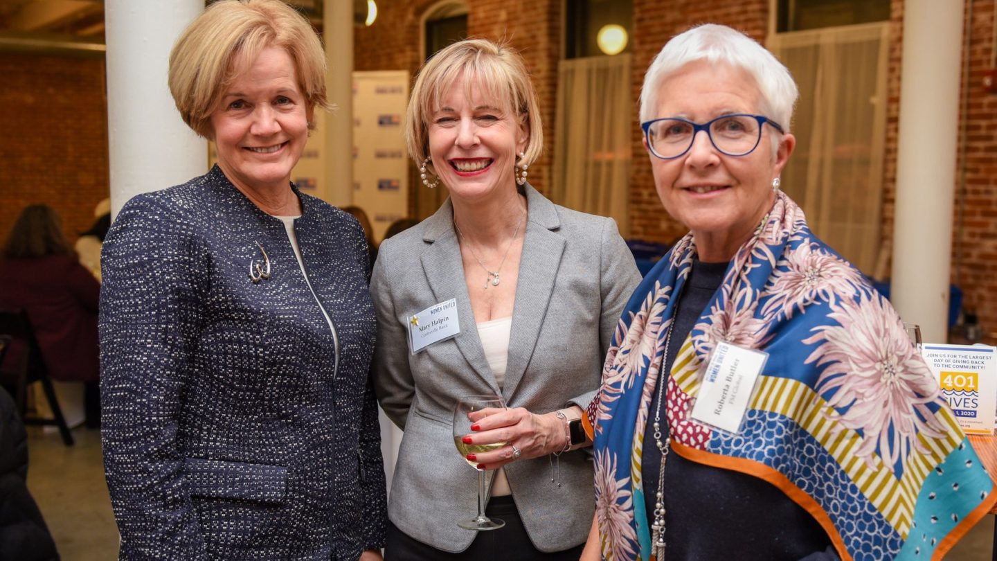 Three smiling Women United members (left to right): Peggy Lawlor Lamb, Mary Halpin, and Roberta Butler.