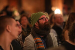 Audience members watch as the Nonprofit Innovation Lab fellows make their final pitches.