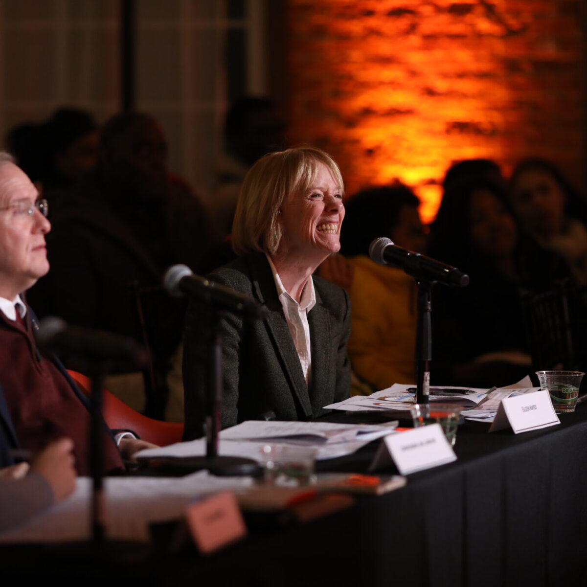 Congressman James Langevin, Eileen Hayes, president and CEO of Amos House, and Maria Kasparian, executive director of Edesia, judge the final pitches.
