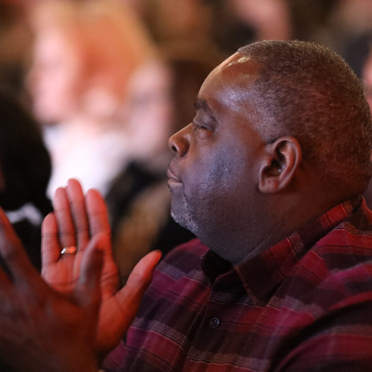 Audience members applaud the Nonprofit Innovation Lab fellows.