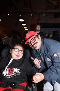 Christopher Antao, founder of Gnome Surf, with an audience member wearing a Gnome Surf hoodie.