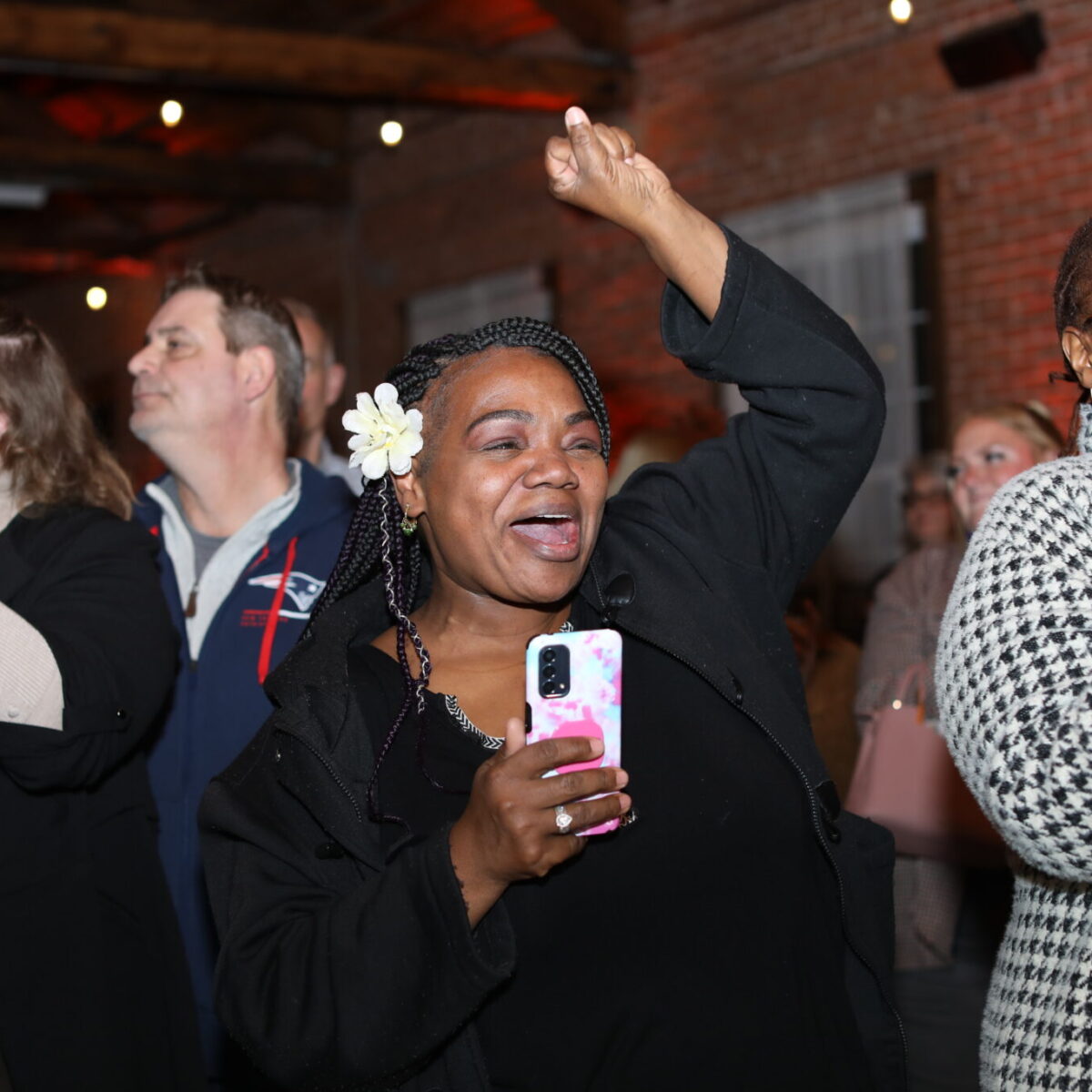 Audience members cheer on the Nonprofit Innovation Lab fellows.