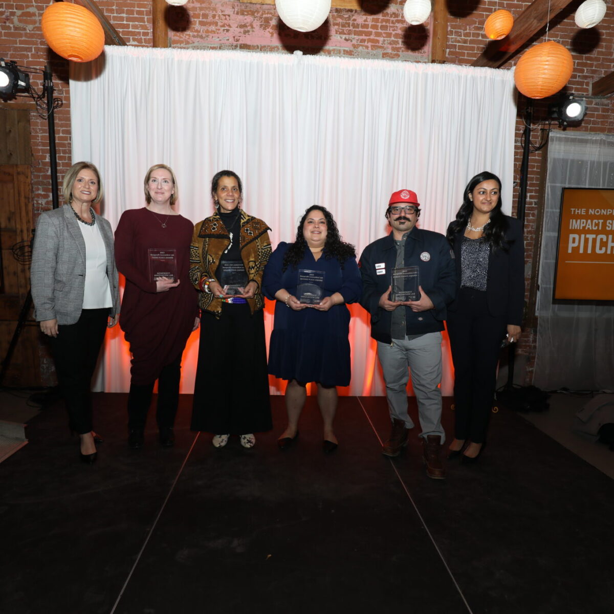 Winners of the Nonprofit Innovation Lab with Cortney Nicolato, president and CEO of United Way of Rhode Island, and Hina Musa, CEO of Social Enterprise Greenhouse.