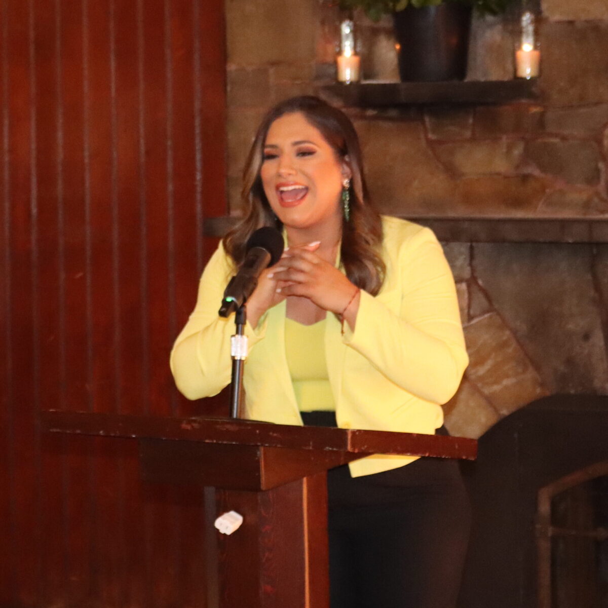 Emcee Carla Rojo, bilingual reporter for NBC Boston/Telemundo Nueva Inglaterra, shares remarks.
