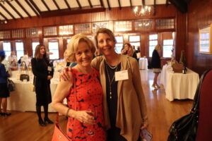 Peggy Lamb, outgoing chair of the Women United Executive Committee, poses with Lisa Curry.