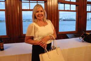 An attendee poses with a purse.