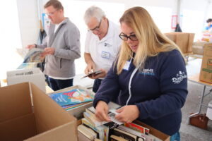 Frank Flynn, AFT vice president, labels books with other volunteers.