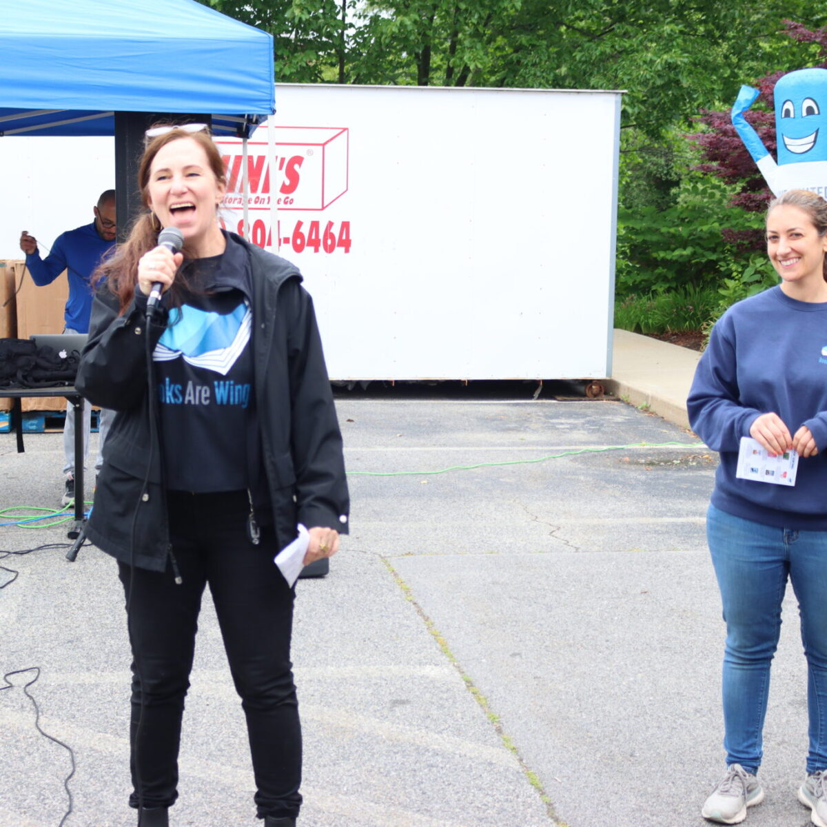 Jennifer Smith, executive director of Books Are Wings, shares remarks.