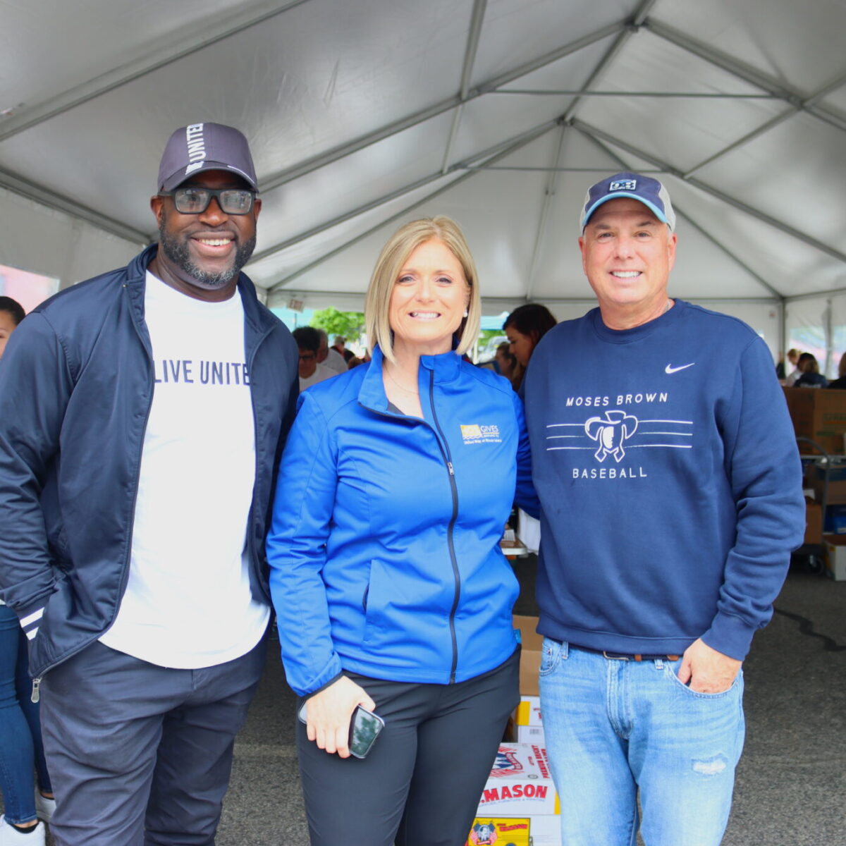 United Way of Rhode Island's Cortney Nicolato and Lanre Ajakaiye with board chair Dolph Johnson.
