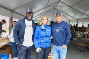 United Way of Rhode Island's Cortney Nicolato and Lanre Ajakaiye with board chair Dolph Johnson.