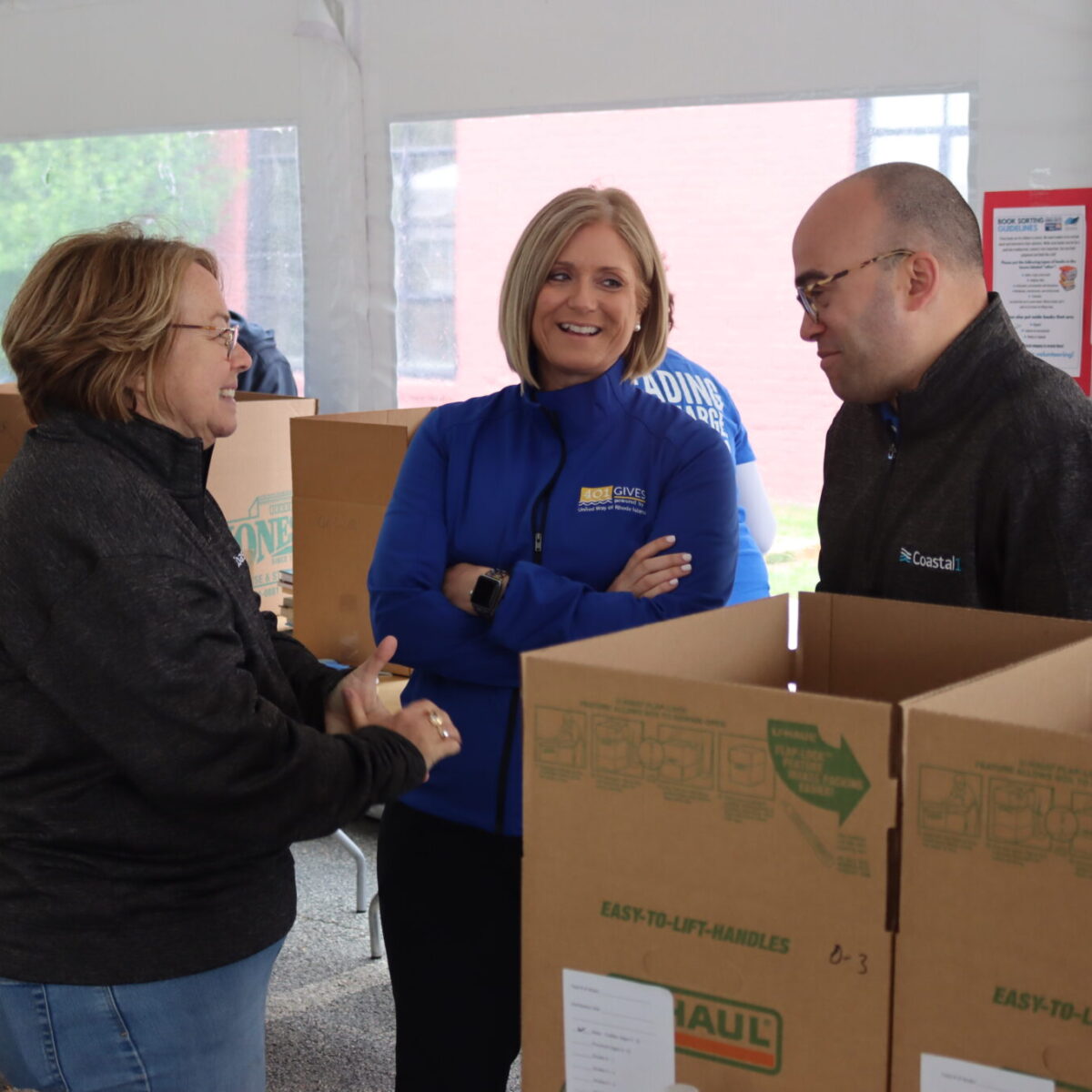 Cortney Nicolato, United Way of Rhode Island's president and CEO, talks with volunteers.