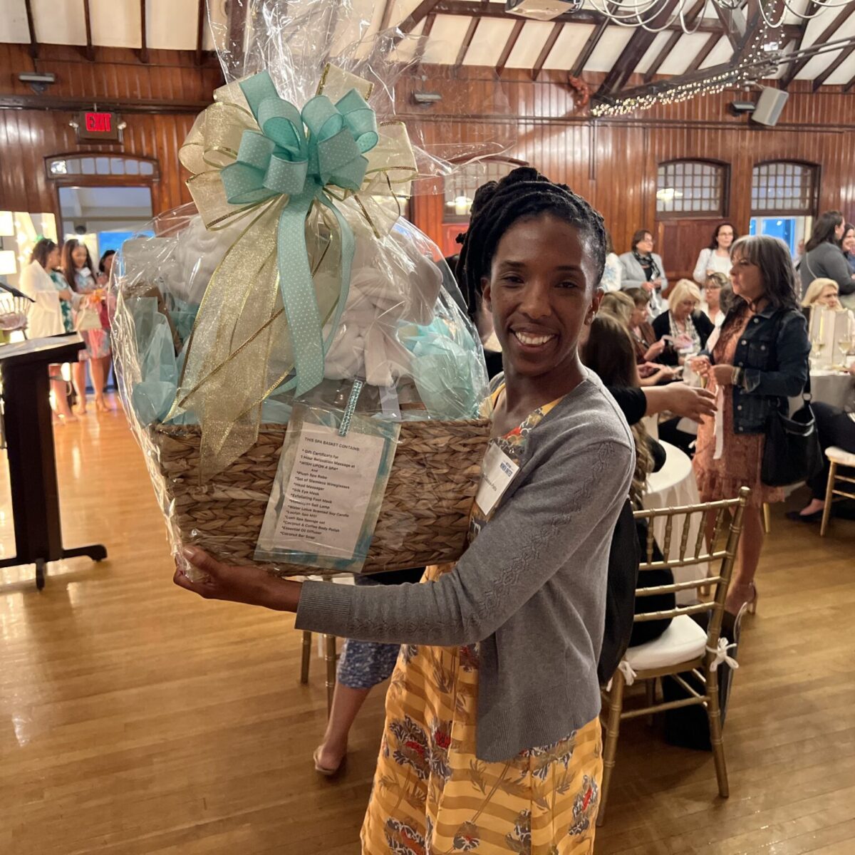Paige Clausius-Parks, executive director of Rhode Island KIDS COUNT, poses with a door prize.