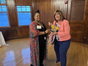 Lauren Nance, program officer for United Way of Rhode Island, poses with a raffle prize winner.