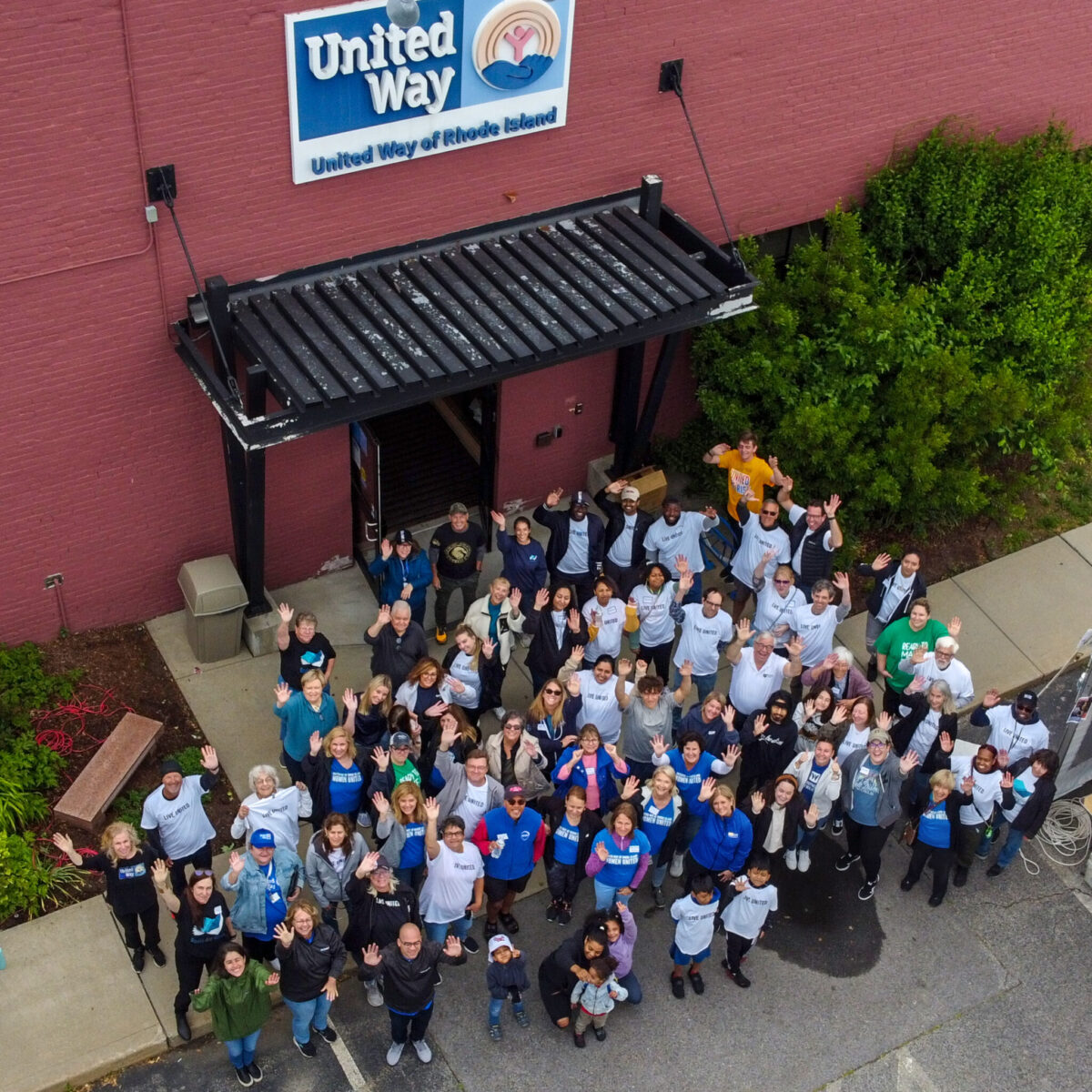 Volunteers pose for a drone shot in front of the United Way of Rhode Island offices.