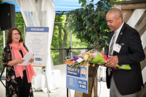 Kyle Bennett presents a bouquet to Meg Chevalier.