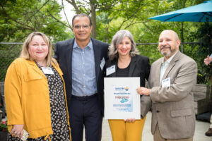 Zoya Tseytlin, Miguel Bernal, Paola Fernandez, and Mario Bueno pose with the VITA Legendary Community Partner Award.