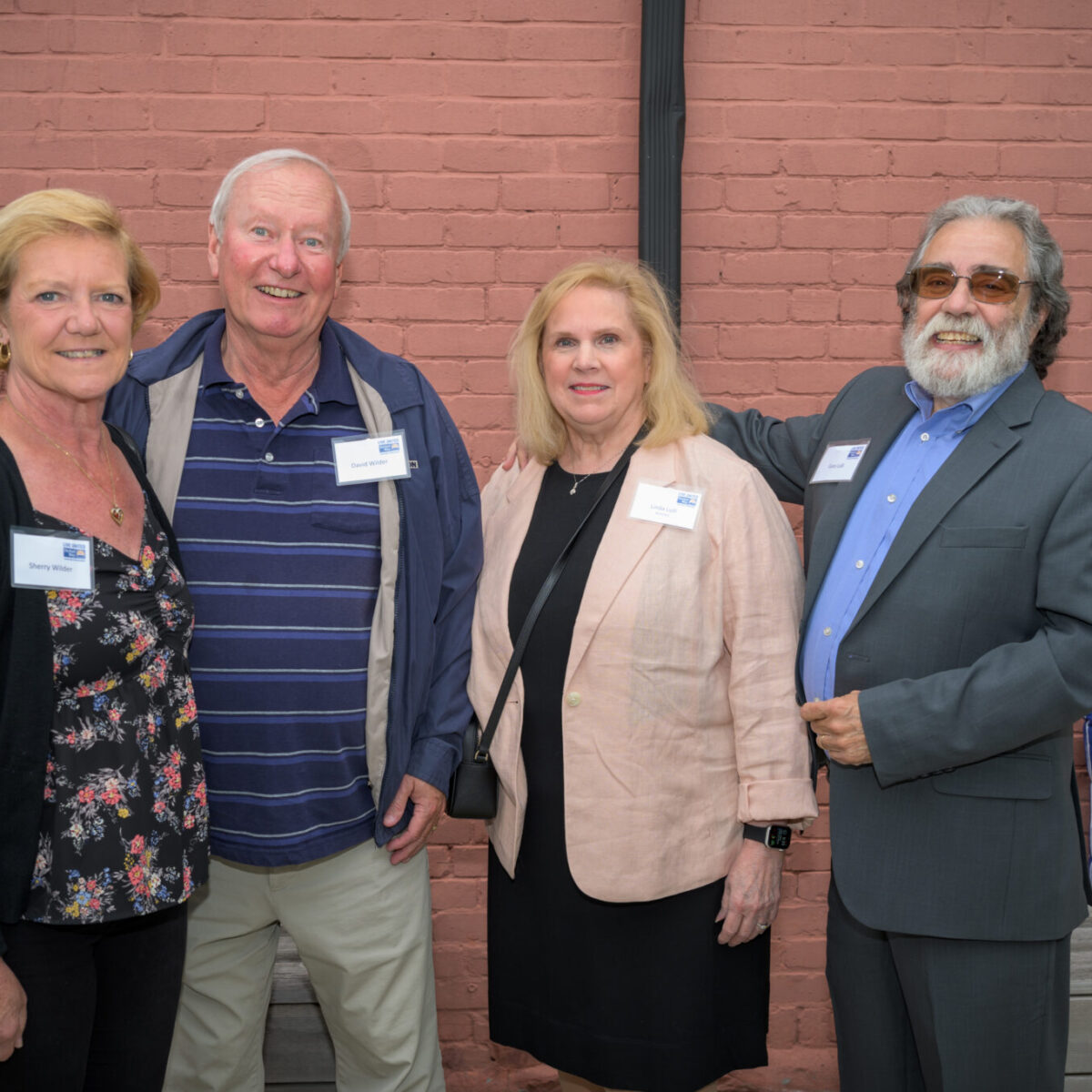 Linda Lulli, recipient of the Women United Award 2023, poses with other attendees.