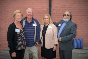 Linda Lulli, recipient of the Women United Award 2023, poses with other attendees.