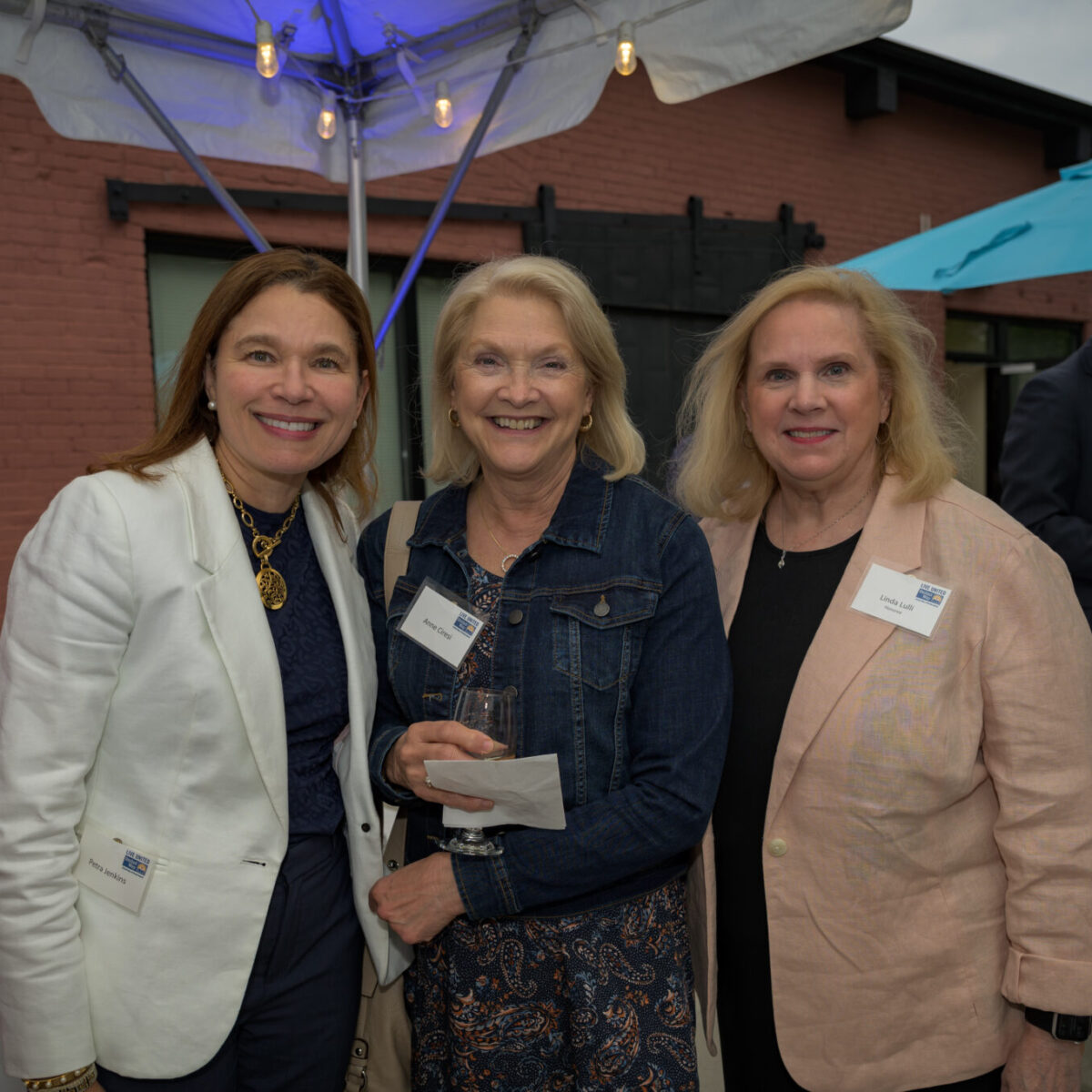 Linda Lulli, recipient of the Women United Award 2023, poses with Petra Jenkins and Anne Ciresi.