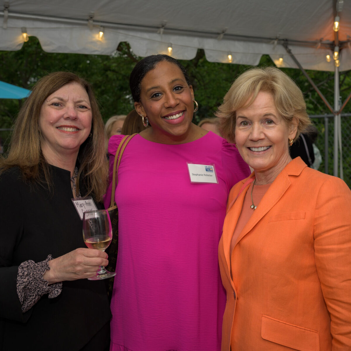 Women United members Mary-Ann Connor, Stephanie Pelletier, and Peggy Lamb pose for a photo.
