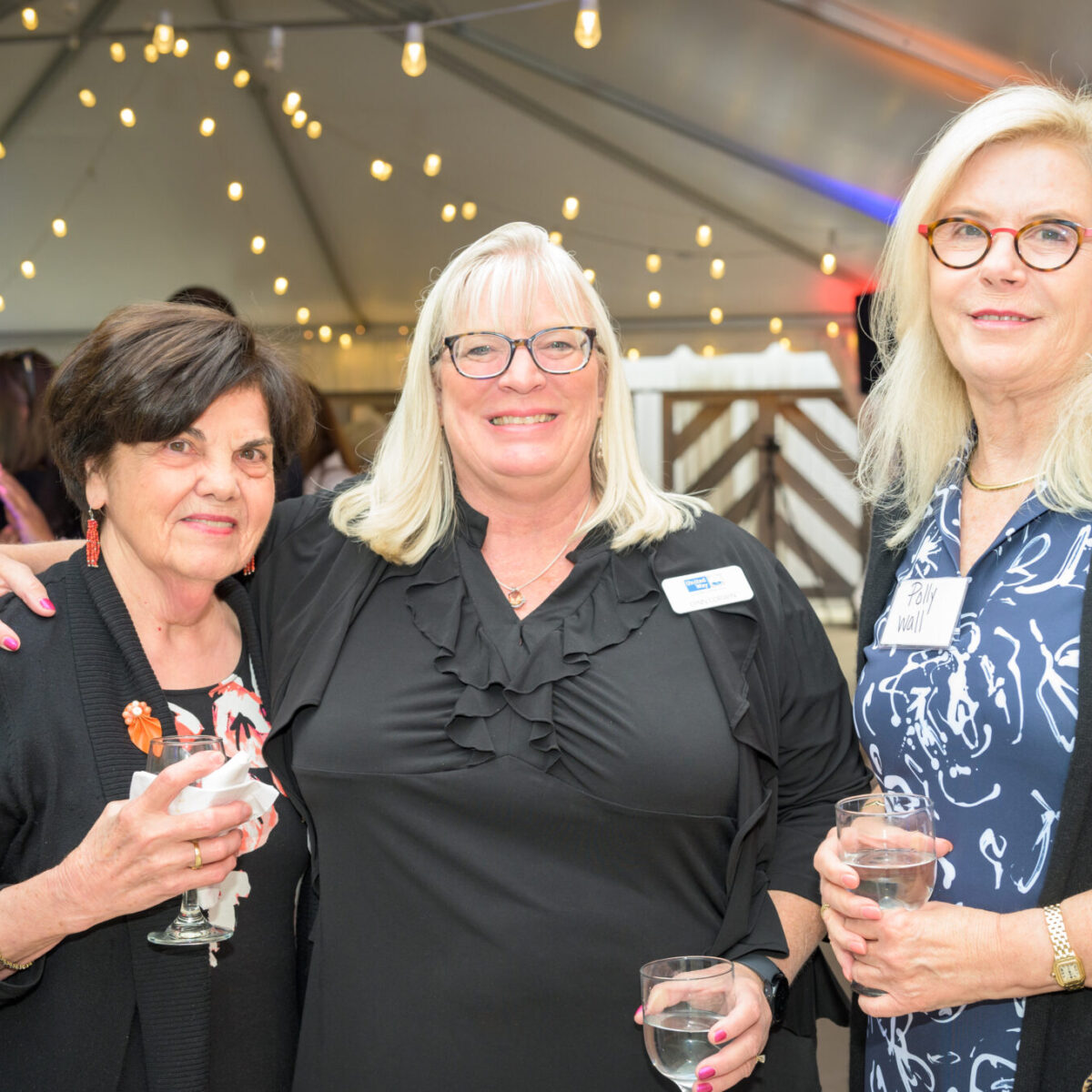 Lynn Corwin, executive advisor for United Way of Rhode Island, poses with other attendees.