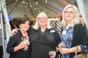 Lynn Corwin, executive advisor for United Way of Rhode Island, poses with other attendees.