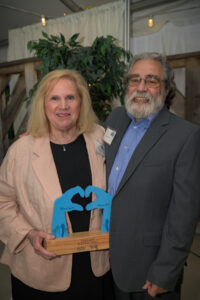 Linda Lulli, recipient of the Women United Award 2023, poses with her husband, Gary Lulli.
