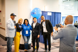 General Treasurer James Diossa posing with United Way of Rhode Island staff and partners.