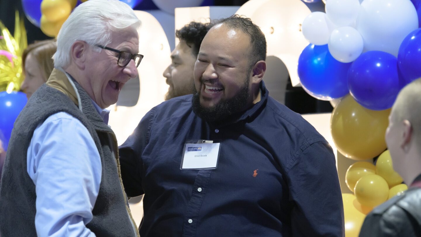 Bill Allen and Elliott Rivera laughing with another attendee.