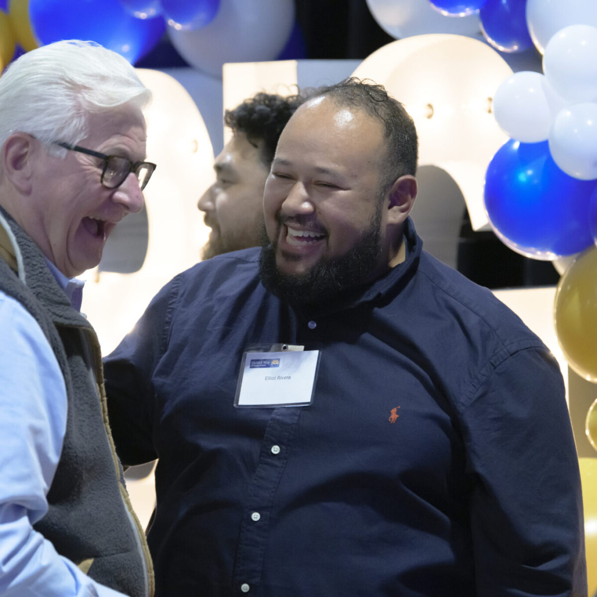 Bill Allen and Elliott Rivera laughing with another attendee.