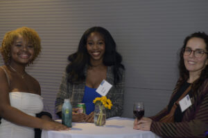 Jully Myrthil, Alivia Free, and Ruth DiGiovanni standing at a cocktail table.