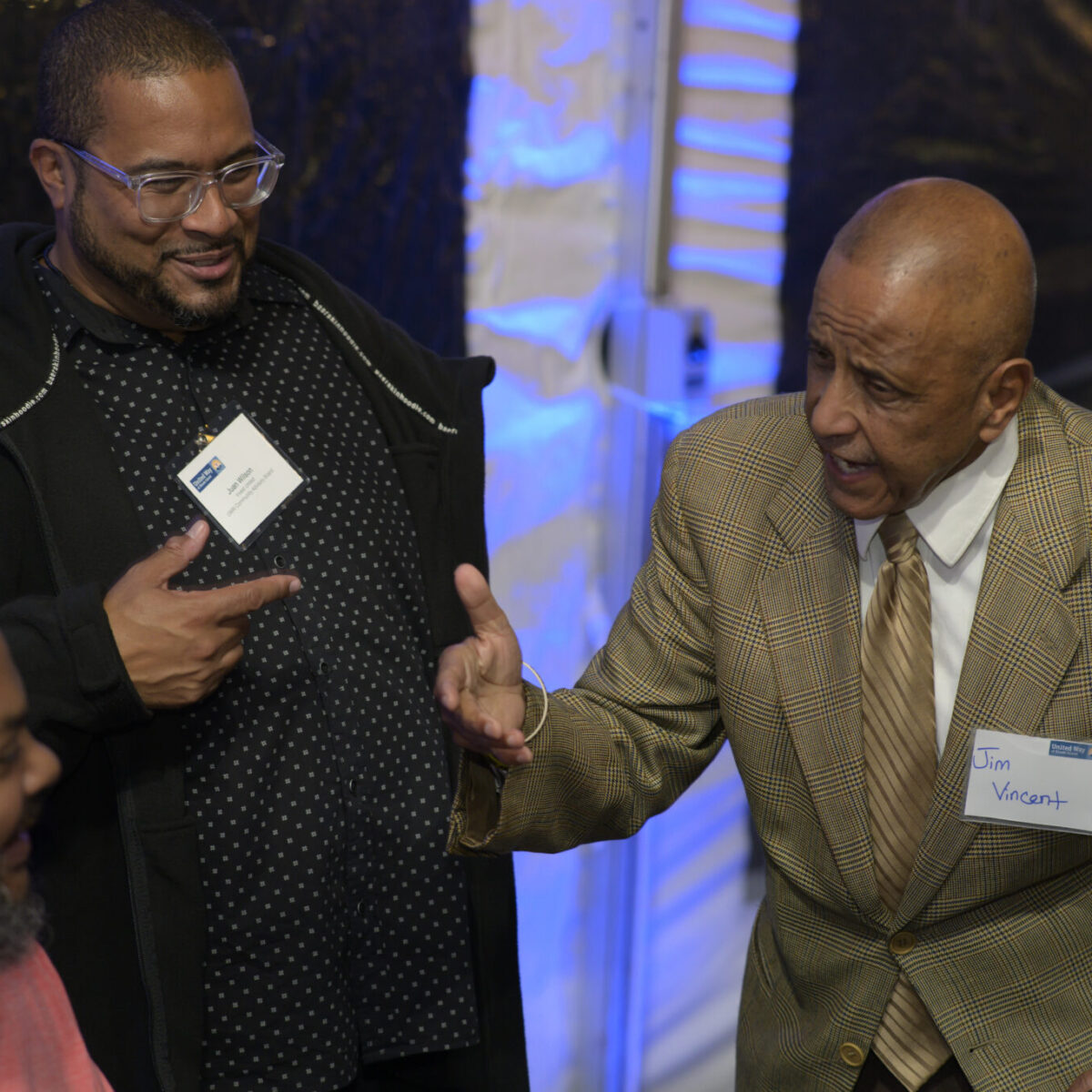 Justin Case, Juan Wilson, and Jim Vincent engaging in a spirited conversation.