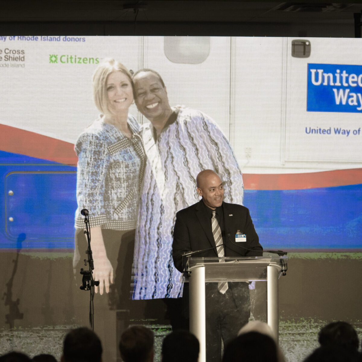 Kyle Bennett introducing Cortney Nicolato, president and CEO of United Way of Rhode Island.