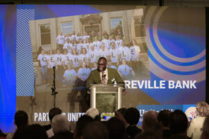 Lanre Ajakaiye introducing Centreville Bank, winner of the Partners United Award.