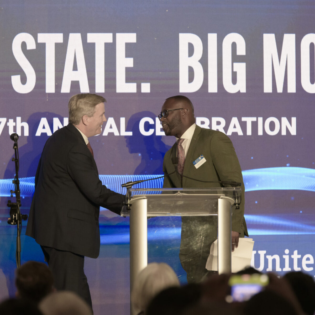 Lanre Ajakaiye shaking hands with Hal Horvat, CEO of Centreville Bank.