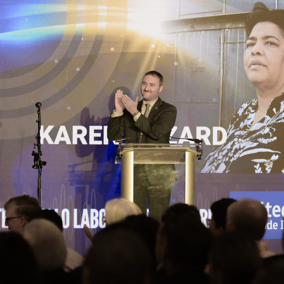 Chris Sabitoni introducing Karen Hazard, winner of the Dante F. Mollo Labor United Award.