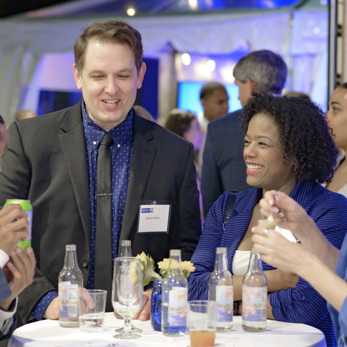 Andrew Grande and Linda Hutchison talking with two other attendees.