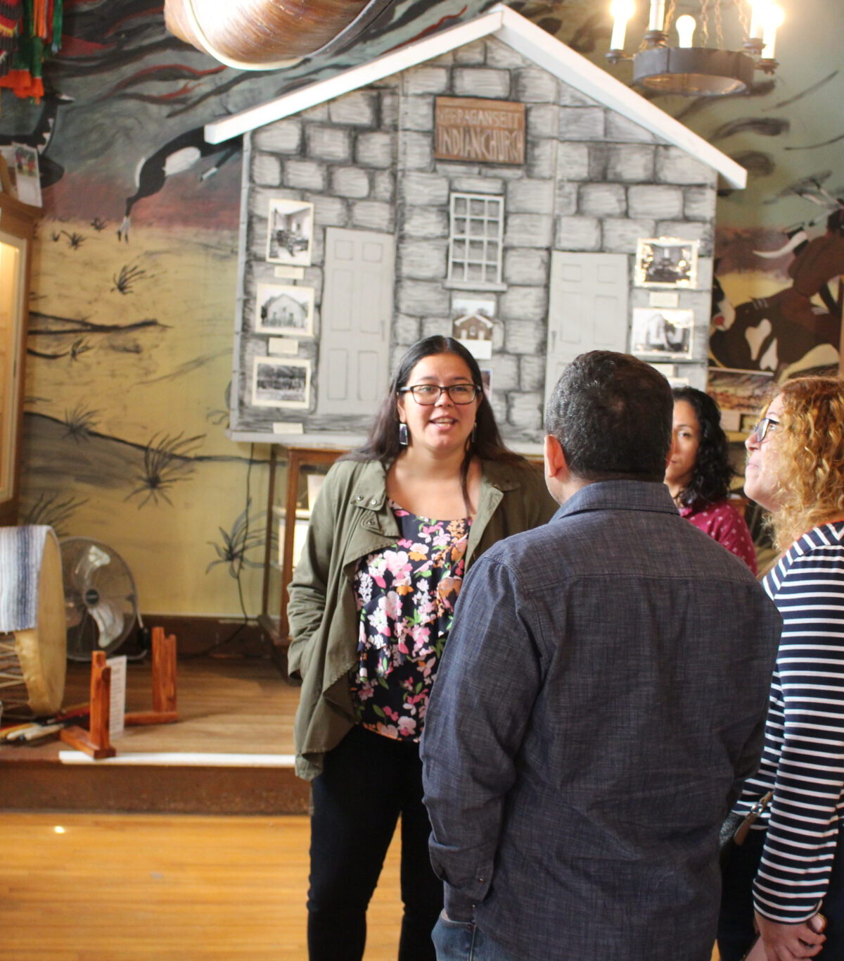 Samantha Cullen-Fry stands in front of a exhibit at the Tomaquag Musuem