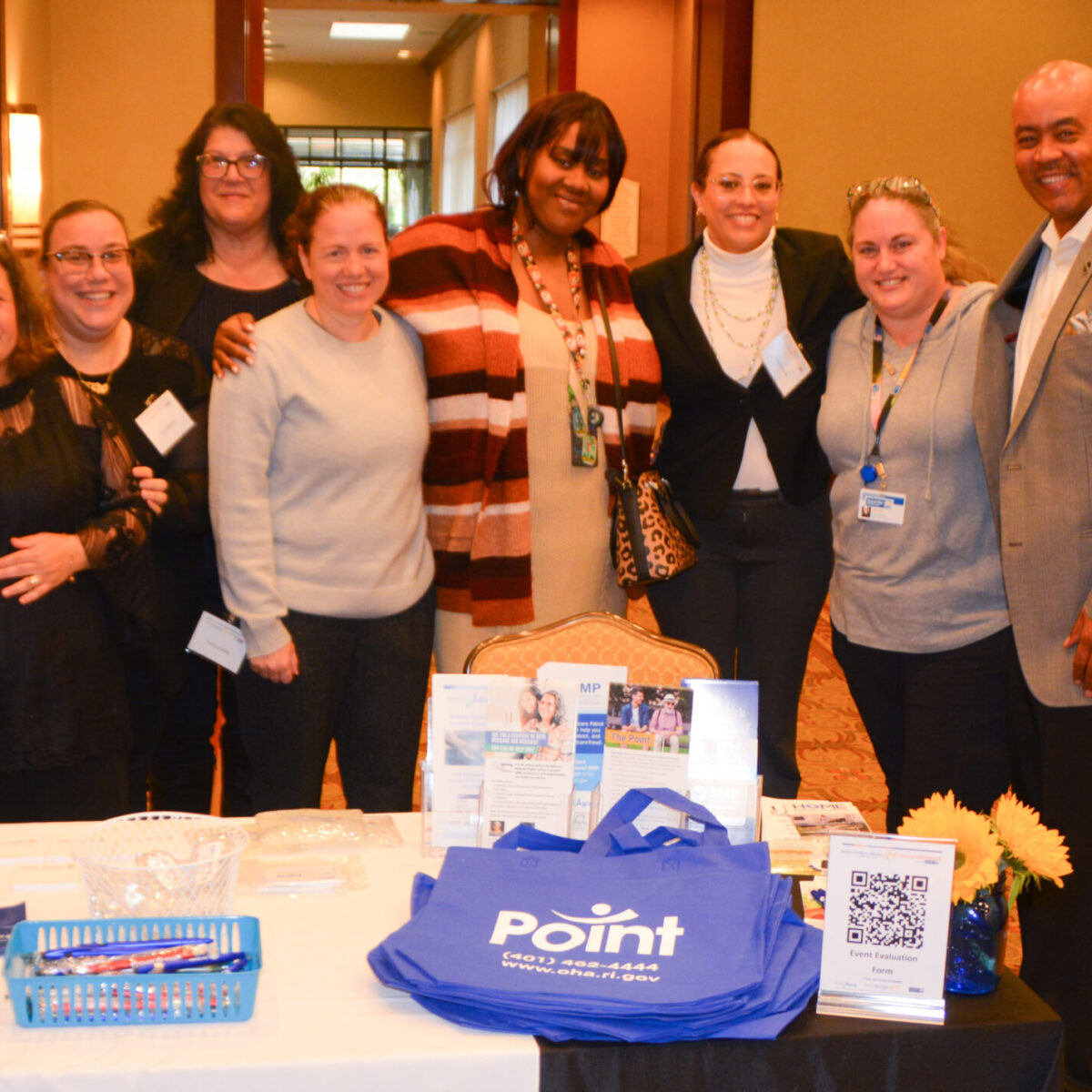 Point team members posing with Kyle Bennett, senior director of policy and equity for United Way of Rhode Island.
