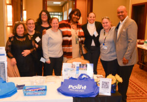 Point team members posing with Kyle Bennett, senior director of policy and equity for United Way of Rhode Island.