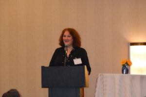 Maria Cimini, director of the Rhode Island Office of Healthy Aging, giving welcoming remarks.