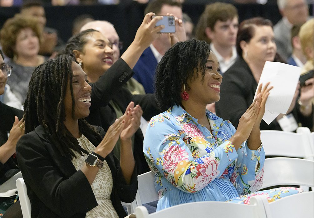 Rhode Island KIDS COUNT's Paige Clausius-Parks and the Economic Progress Institute's Weayonnoh Nelson-Davies clapping.