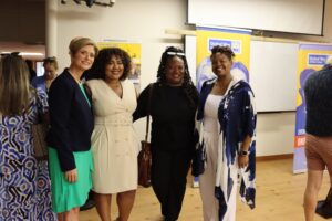 Cortney Nicolato, president and CEO of United Way of Rhode Island, posing with Karla Alba, Adama Brown, and Lauren Nance.