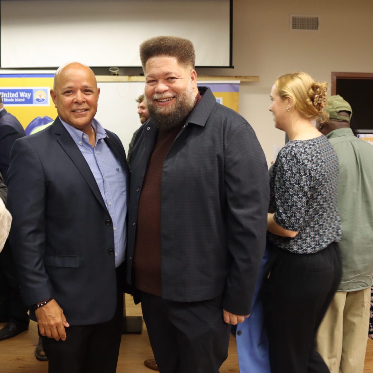 Rodney Davis, chairperson of the Providence Municipal Reparations Commission, with Providence City Councilman Juan Pichardo.