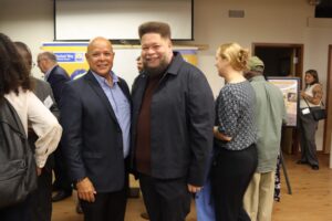 Rodney Davis, chairperson of the Providence Municipal Reparations Commission, with Providence City Councilman Juan Pichardo.