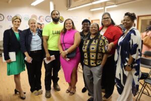 Members of Team United posing with Providence City Council President Rachel Miller and other community partners.