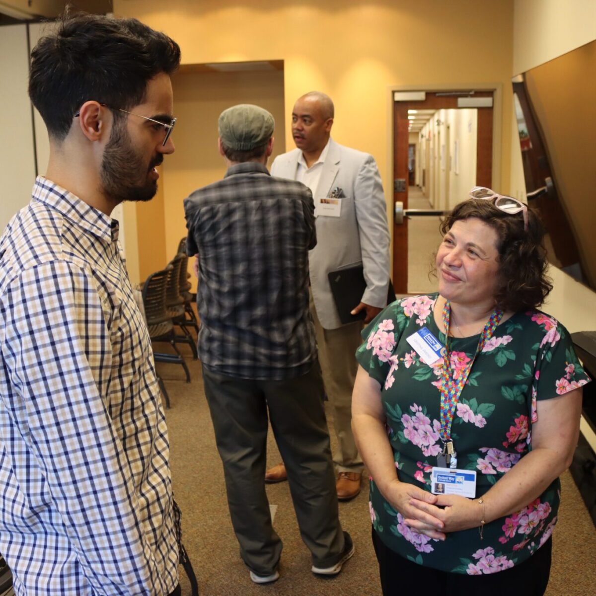 The Economic Progress Institute’s Hector Perez Aponte talking with United Way of Rhode Island’s Cristina Amedeo.