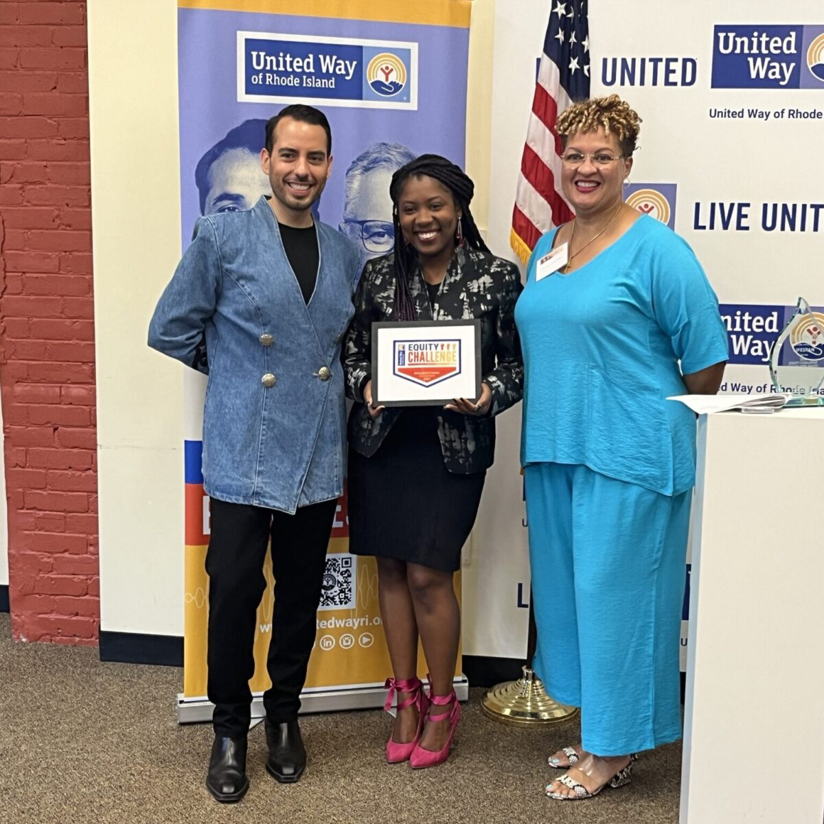 Kevin Matta and Lifespan's Christin Zollicoffer posing with Rhode Island for Community and Justice's Rose Albert.