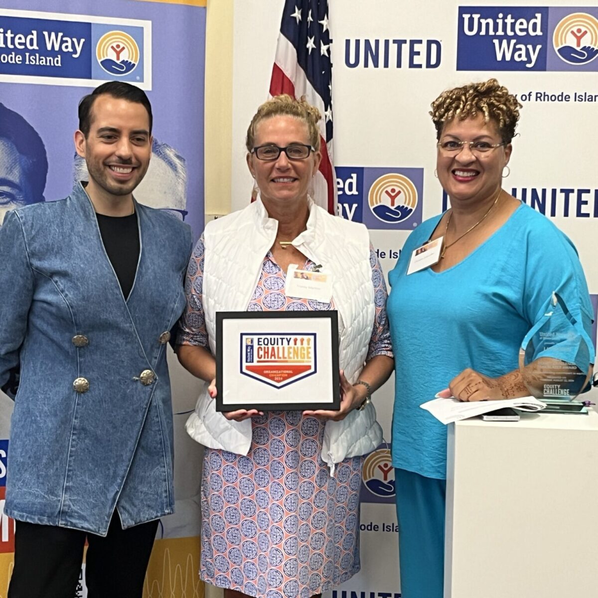 United Way of Rhode Island's Kevin Matta and Lifespan's Christin Zollicoffer posing with AccessPoint RI's Tracey Martins.
