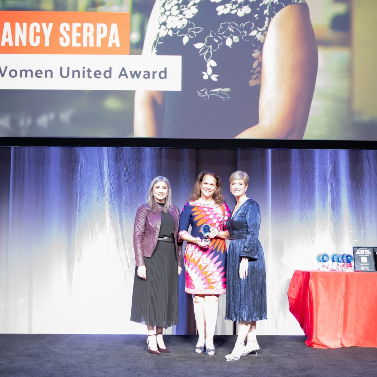Nancy Serpa, recipient of the Women United Award, posing with Cortney Nicolato and Paola Fernandez.